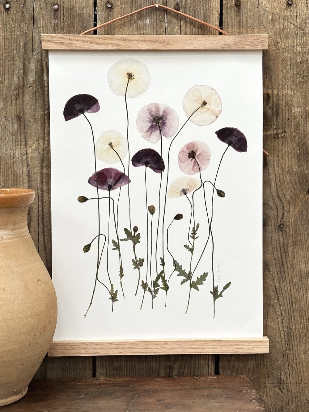 Flot billede til stuen med presset blomster